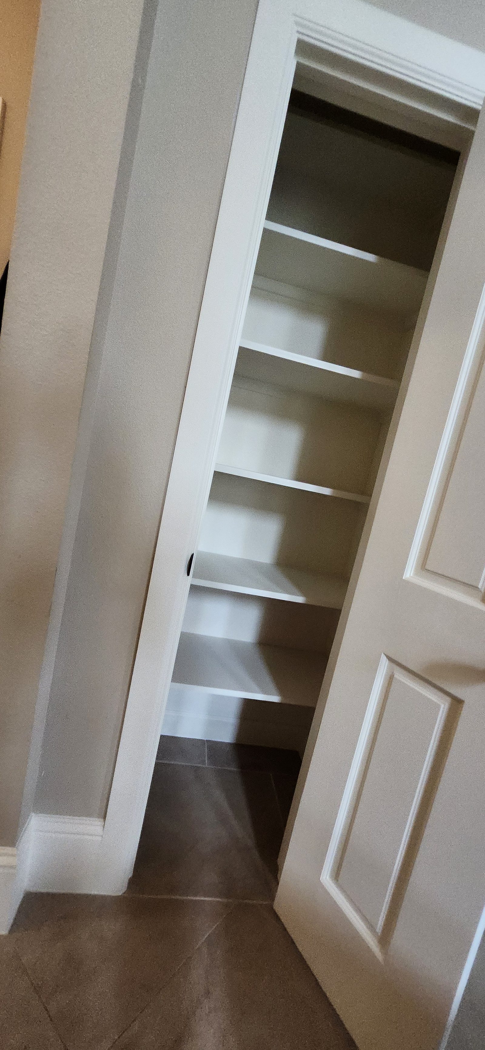 New closet with built-in shelving after wall conversion in Katy, TX