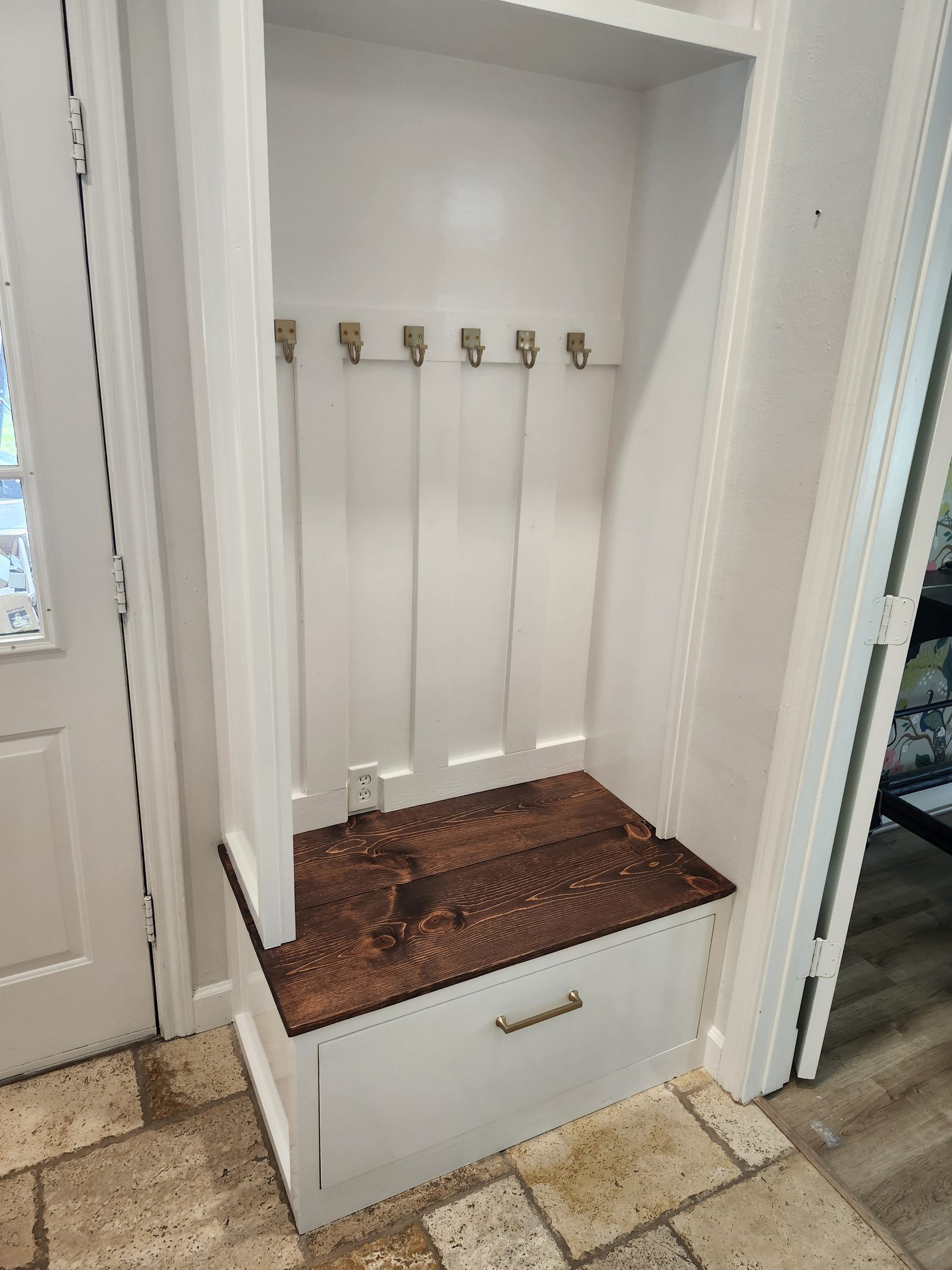 Built-in mud bench with hooks and drawer storage in Katy, TX
