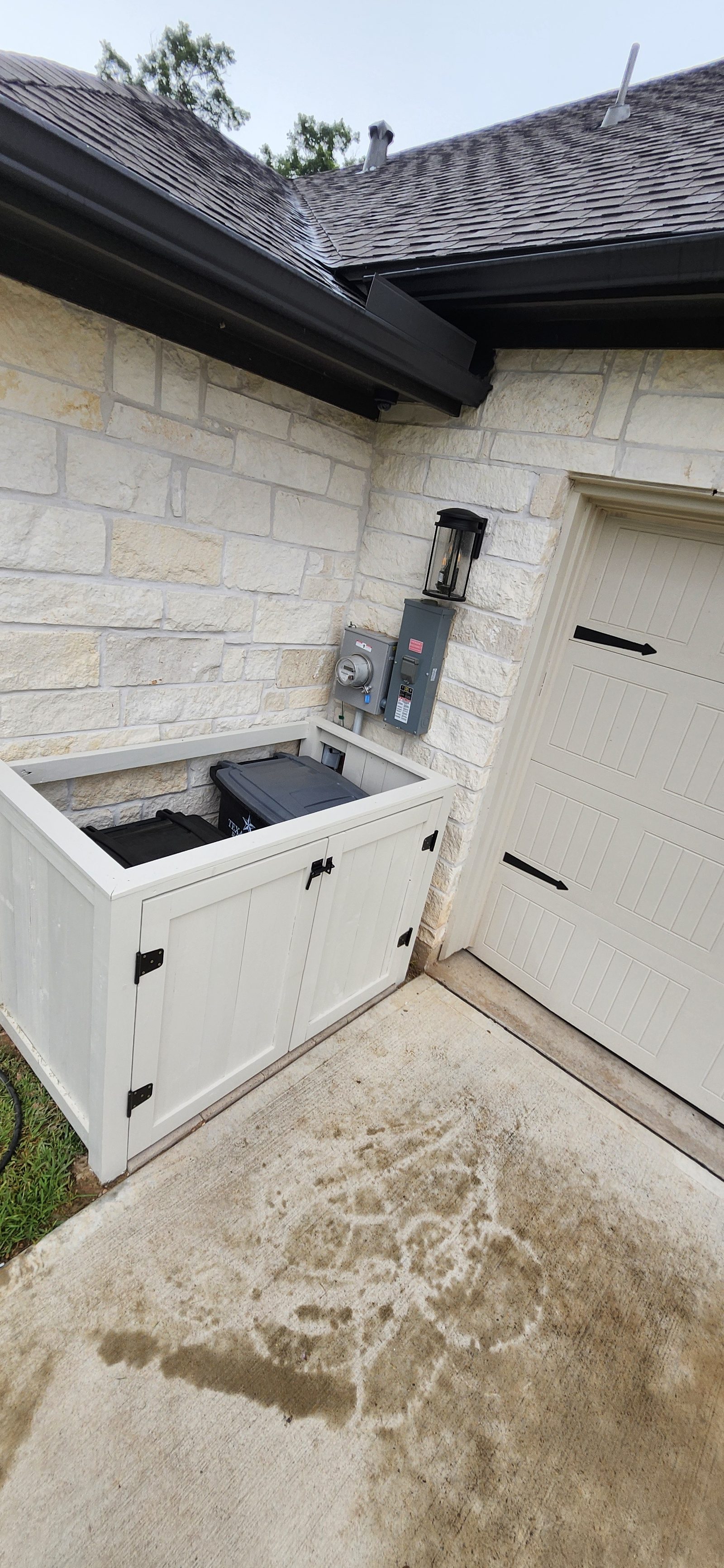 Built trash can corral enclosure on a home exterior in Katy, TX