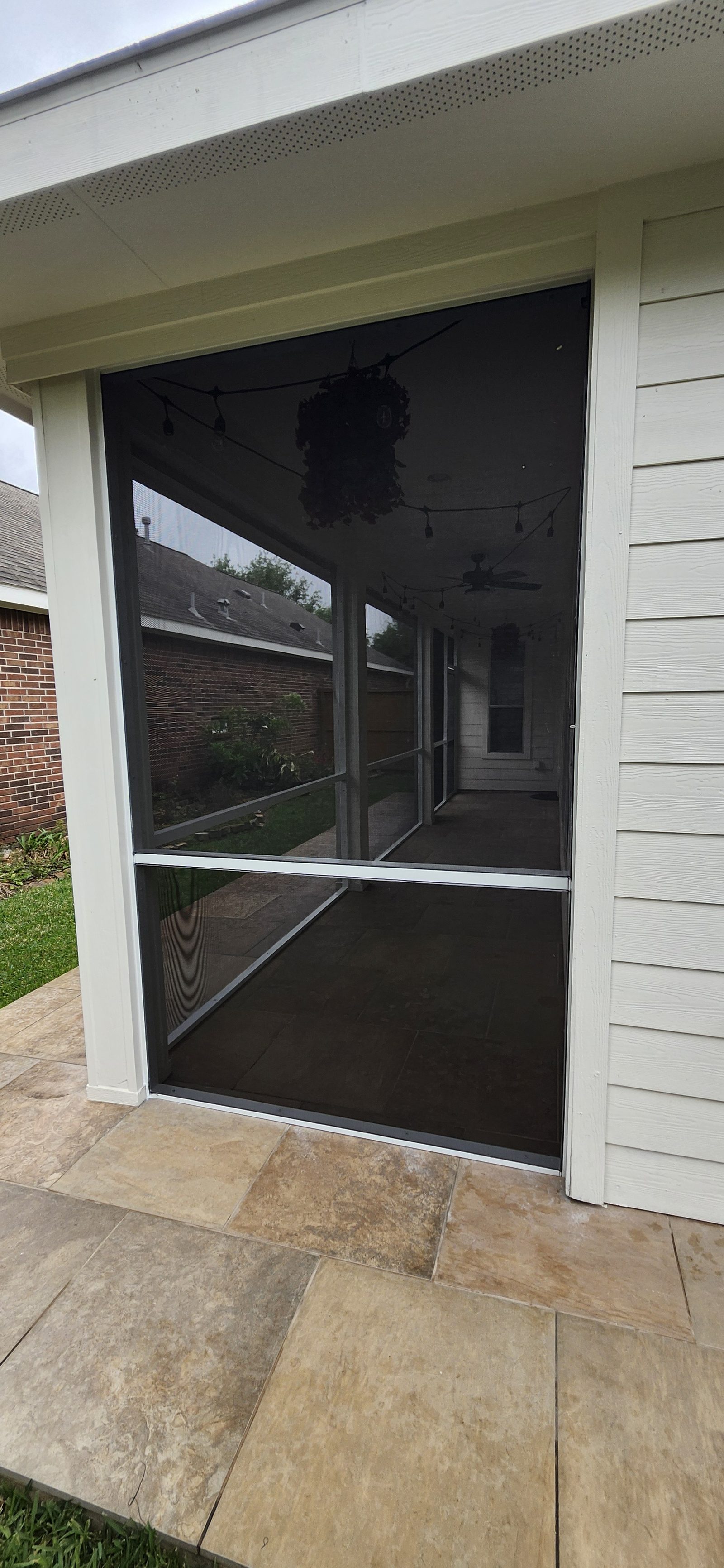 Interior view of a newly built screened patio enclosure in Katy, TX