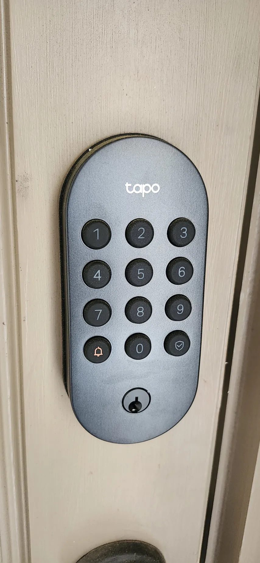 Smart Tapo keypad deadbolt lock installed on a front door in Katy, TX