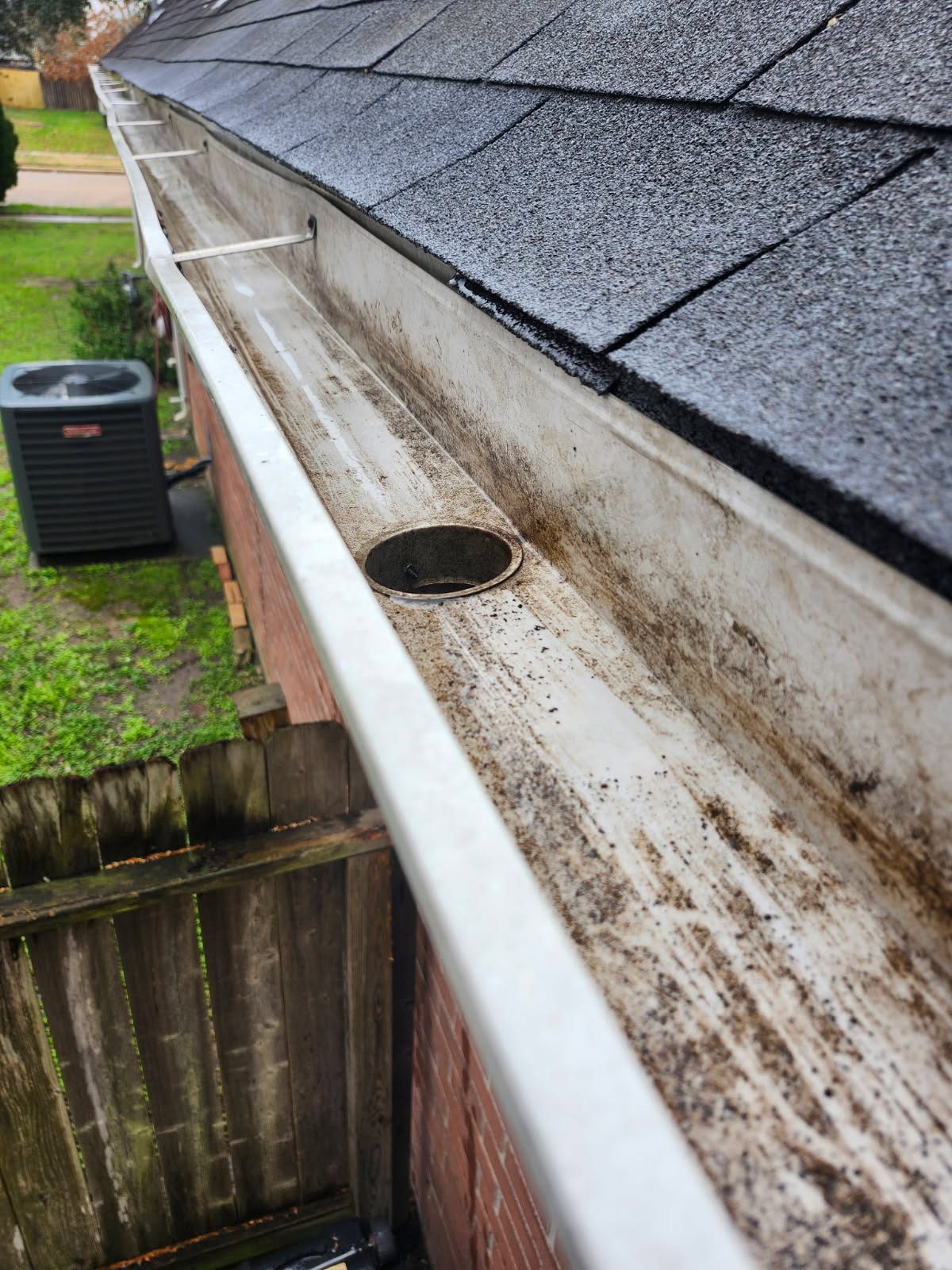 Clean, debris-free gutter channel after gutter cleaning service in Katy, TX