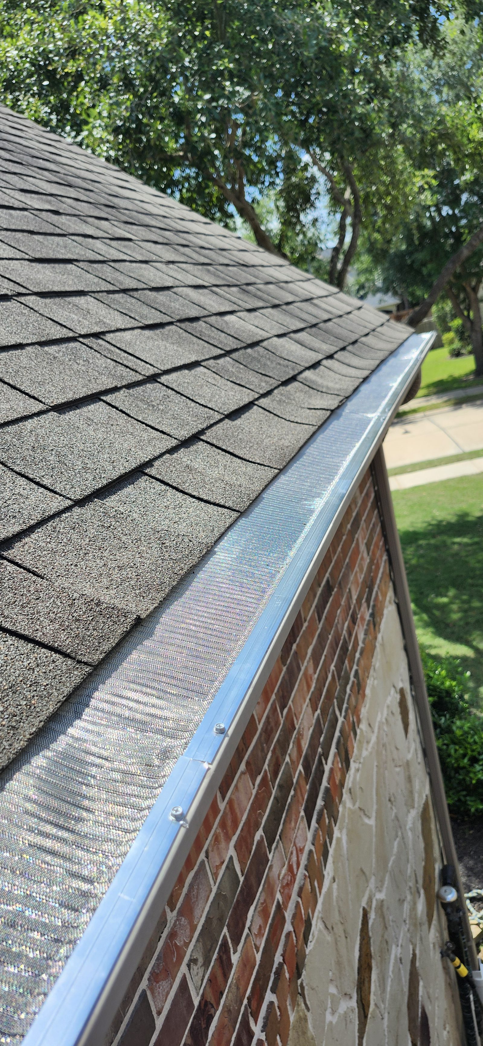 Close-up of mesh gutter guard installed on a home in Katy, TX