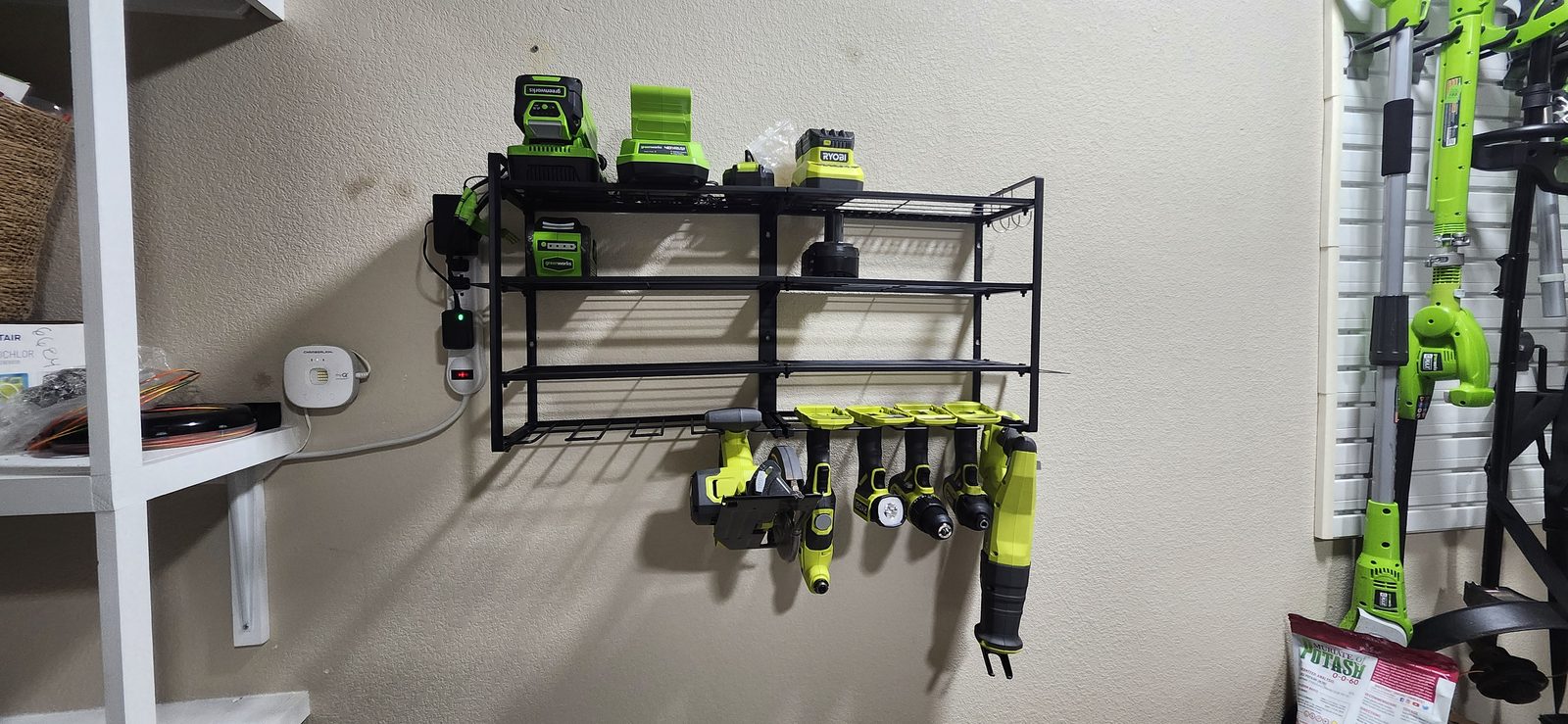 Wall-mounted tool storage rack installed in a garage in Katy, TX