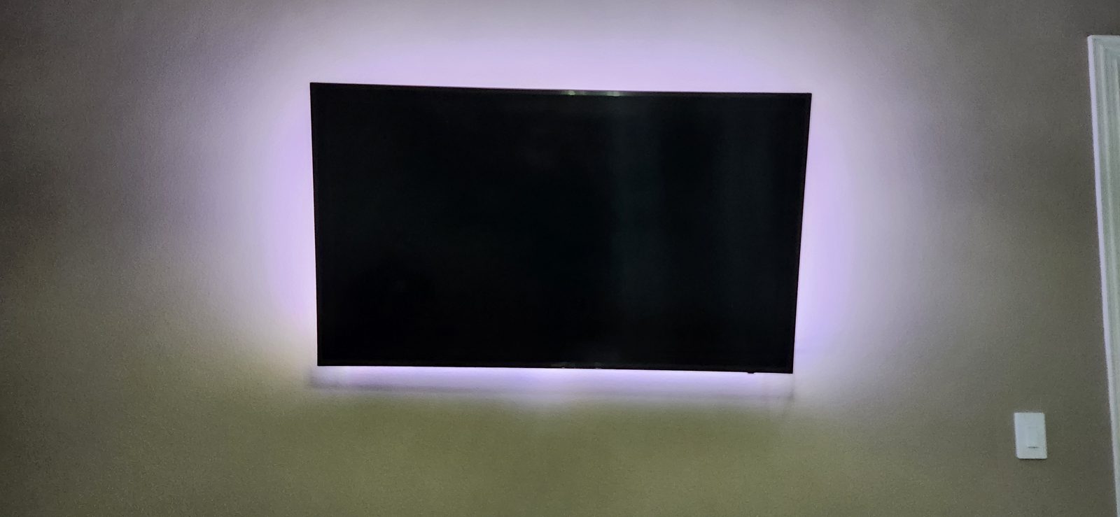 Wall-mounted TV with ambient backlighting in Katy, TX