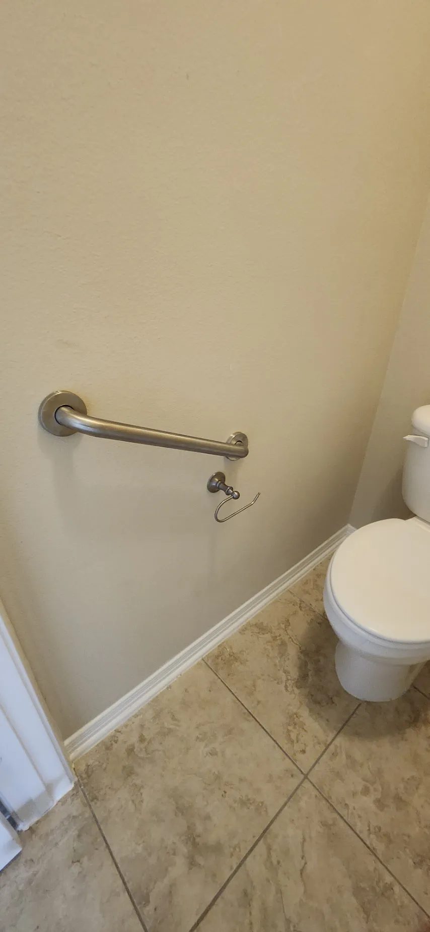 Bathroom grab bar installed near a toilet in Katy, TX