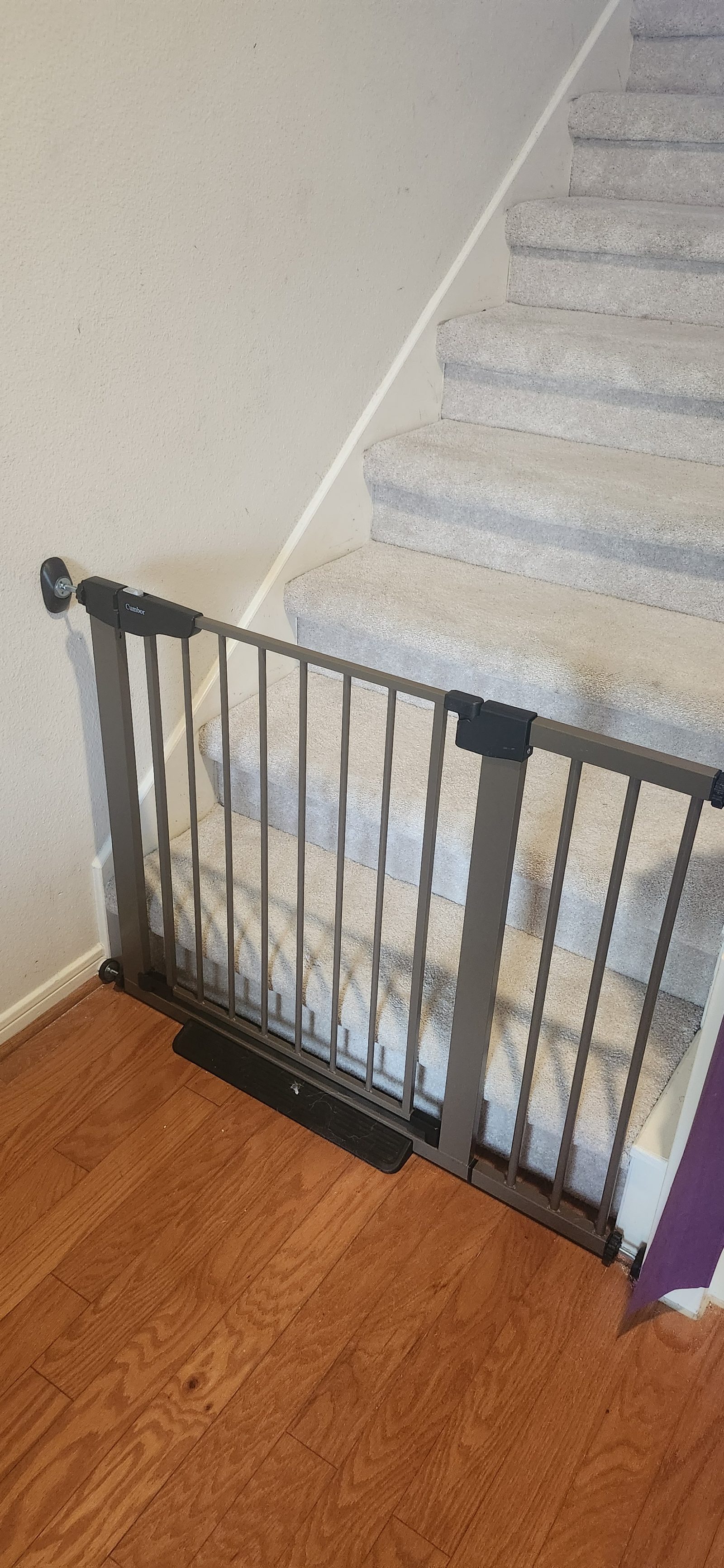 Baby gate installed at the top of a staircase in Katy, TX