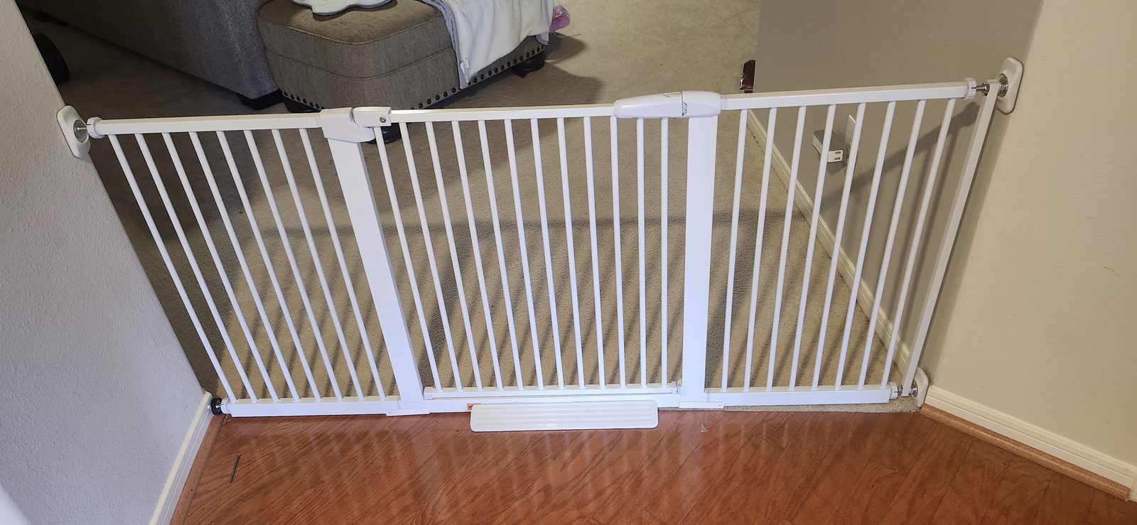 Extra-wide baby gate installed in a hallway in Katy, TX