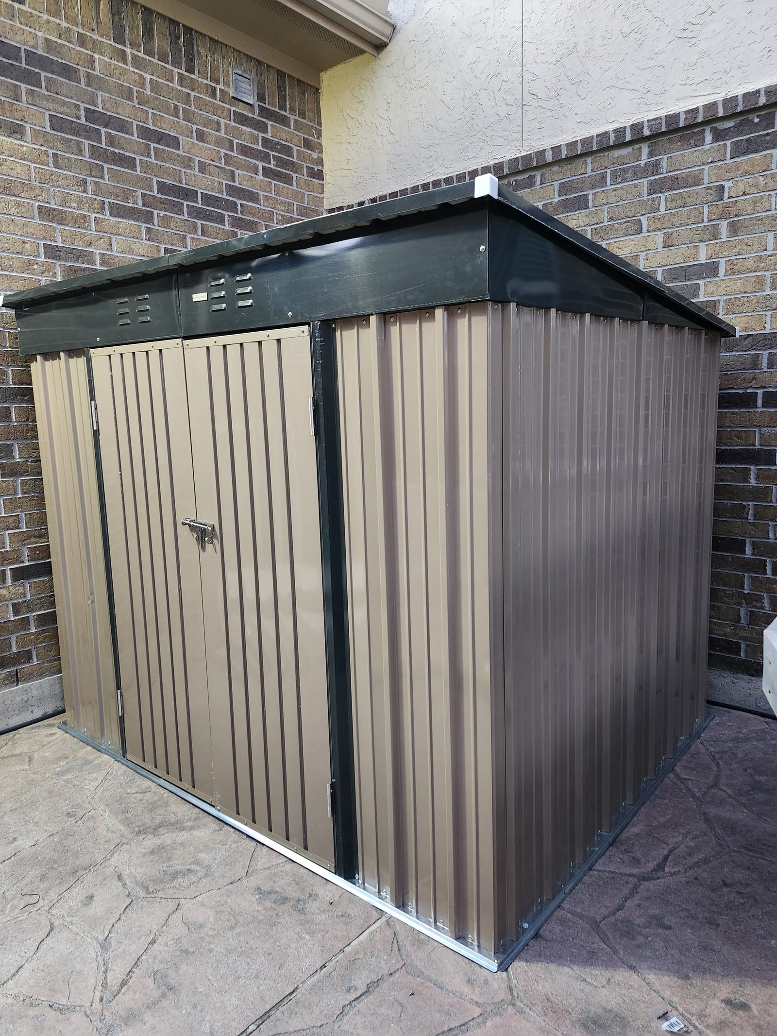 Assembled outdoor storage shed in a backyard in Katy, TX