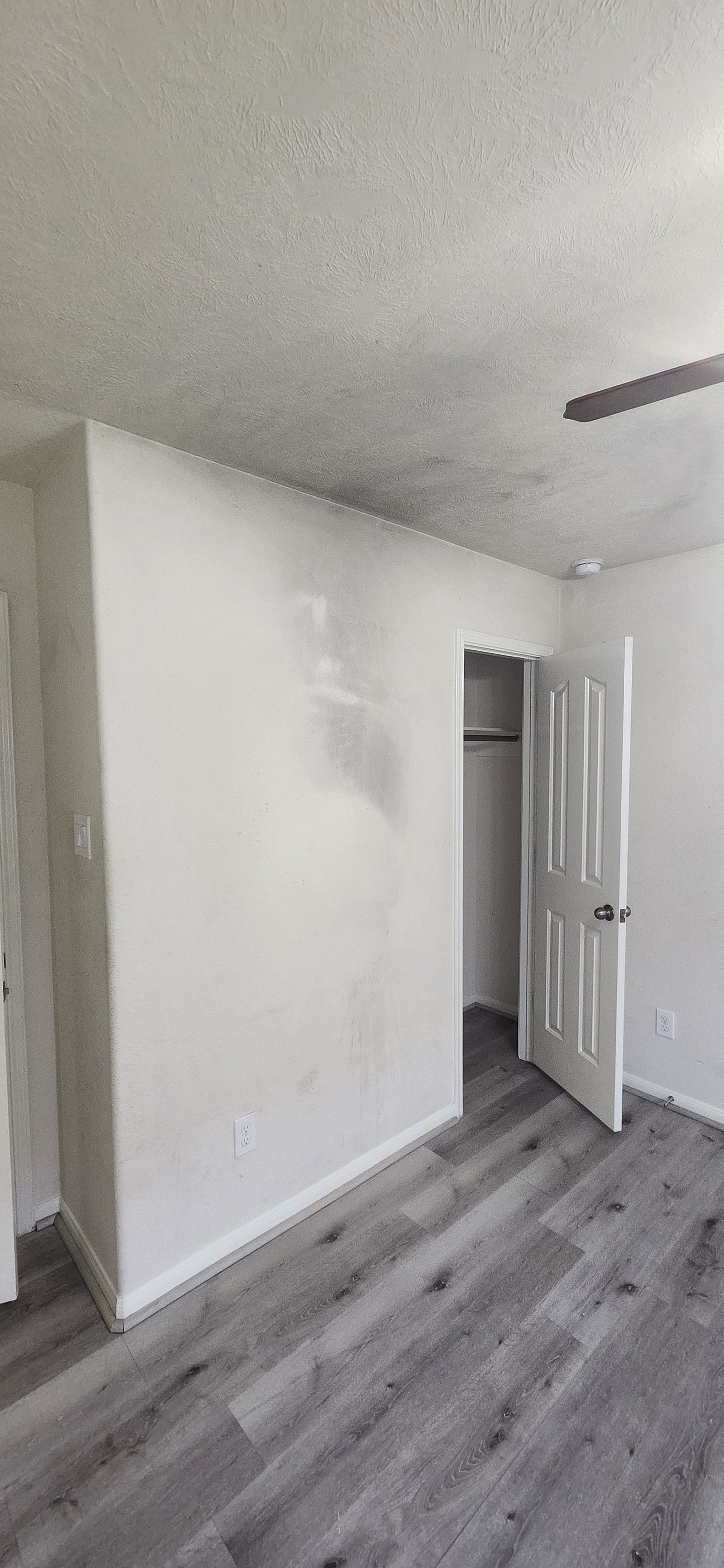 Bedroom wall with a humidity stain before repainting in Katy, TX