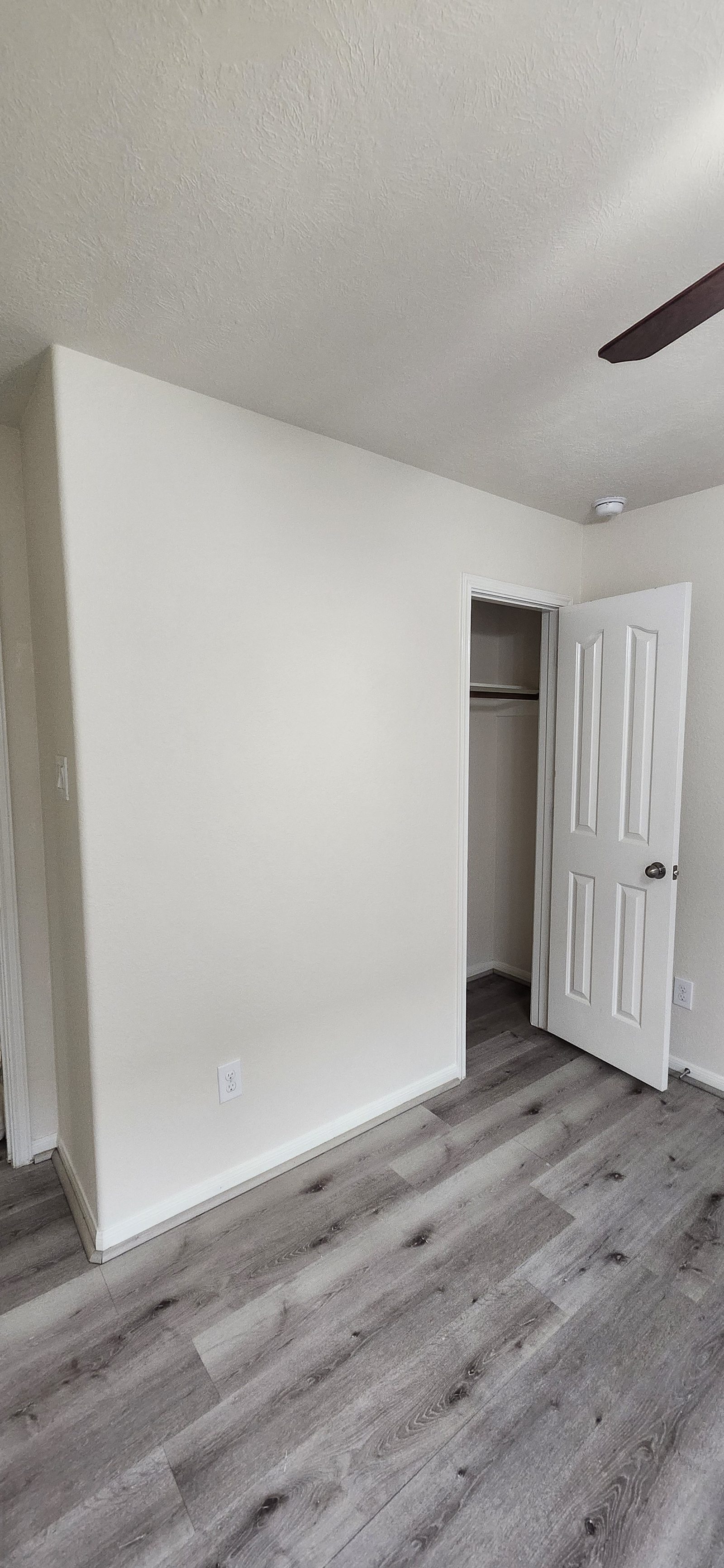 Bedroom wall repainted after humidity stain repair in Katy, TX