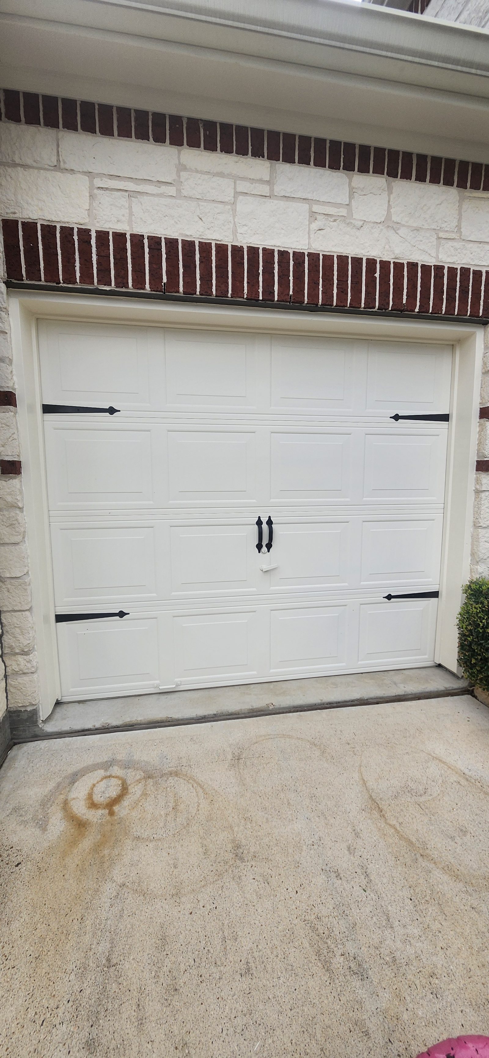 White garage door after exterior painting in Katy, TX